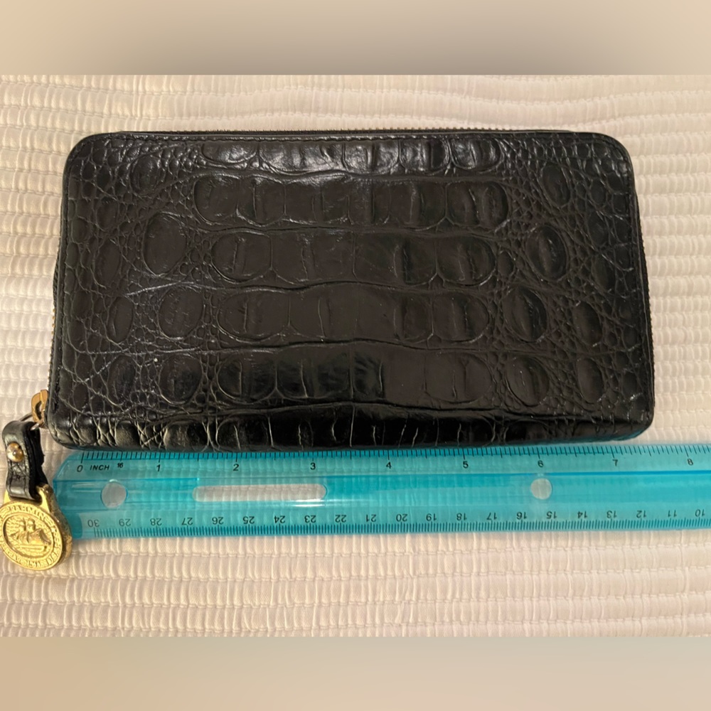 Brahmin black leather zip wallet.